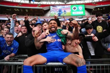 Tobi Adebayo-Rowling soaks up promotion with the Rochdale fans